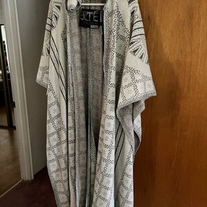 THIS IS AN ERTE CAPE WITH SILVER THREADING,& GREY COLORING
